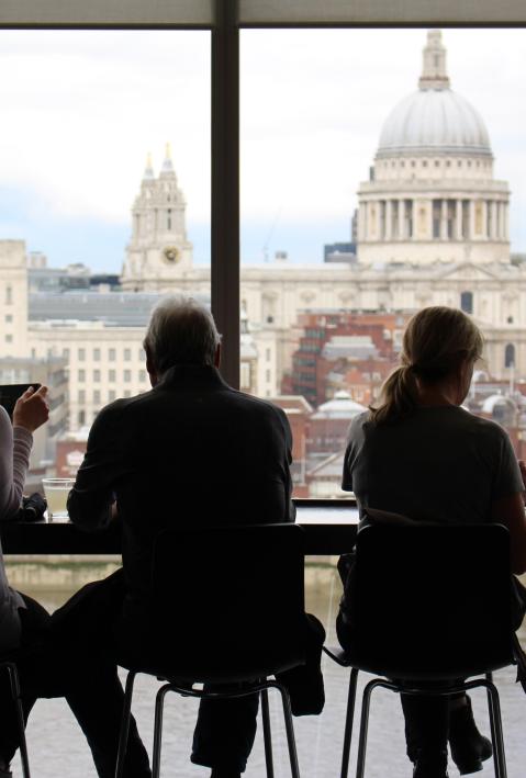 4 people sitting at the table with a view of St Paul's Cathedral