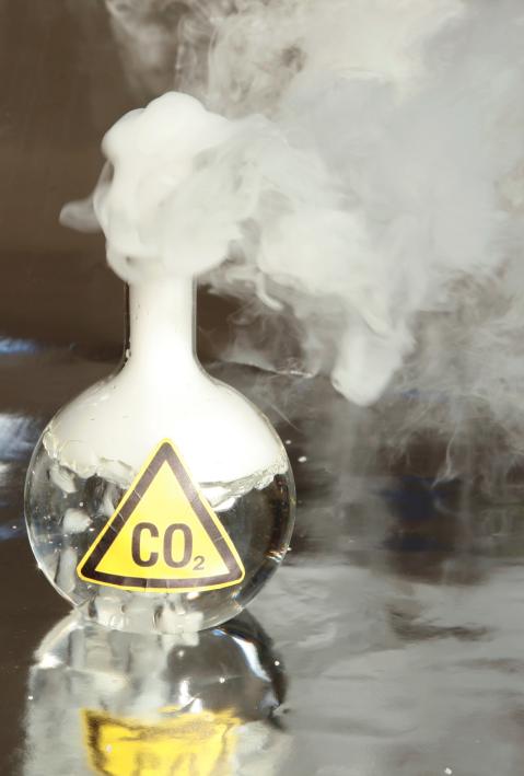 Frozen Carbon Dioxide, aka CO2 aka Dry Ice reacts violently when mixed with water, releasing CO2 into the enviroment
