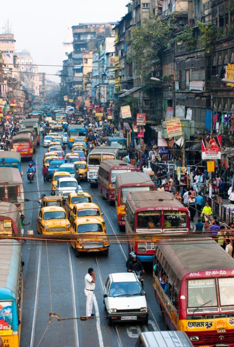Many private cars, yellow cabs and public buses on the street traffic jam on January 18, 2013 in Kolkata, India. Kolkata has a density of 814.80 vehicles per km road length