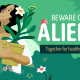 A woman holds a flower pot in her arms and cuts off a little branch. The writing on the image reads "beaware of alines. together for a reads "Beware of aliens. Together for a healthy nature"